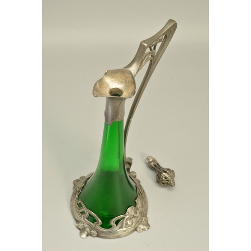 257 - AN ART NOUVEAU WMF (ATTRIBUTED) CLARET JUG, the conical green glass body with openwork stopper and h... 