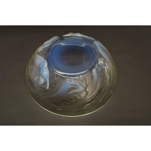 274 - RENE LALIQUE (1860-1945), a circular opalescent bowl in the Ondines pattern, the exterior has relief... 