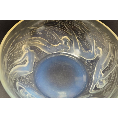 274 - RENE LALIQUE (1860-1945), a circular opalescent bowl in the Ondines pattern, the exterior has relief... 