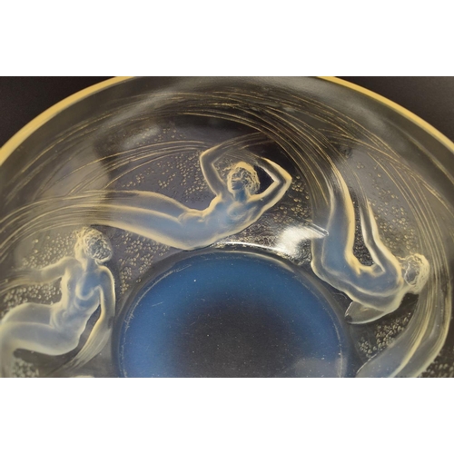 274 - RENE LALIQUE (1860-1945), a circular opalescent bowl in the Ondines pattern, the exterior has relief... 