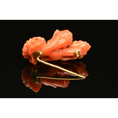 29 - AN EARLY 20TH CENTURY CARVED CORAL BROOCH, designed as a spray of chrysanthemums, measuring approxim... 