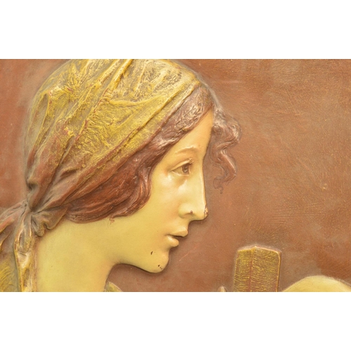 293 - AN EARLY 20TH CENTURY ERNST WAHLISS ART NOUVEAU POTTERY PLAQUE, moulded in relief with a portrait of... 