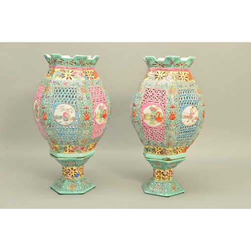 297 - A PAIR OF 20TH CENTURY CHINESE PORCELAIN FAMILLE ROSE TABLE LANTERNS, of hexagonal form, reticulated... 