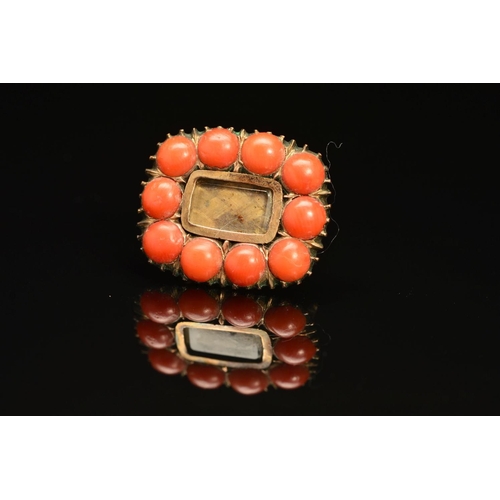 31 - AN EARLY 19TH CENTURY CORAL MOURNING BROOCH, rectangular form with blond plaited hair section, perso... 