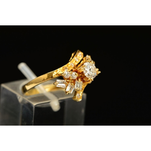 35 - A MODERN DIAMOND DRESS RING, centring on a modern round brilliant cut diamond, estimated weight 0.45... 