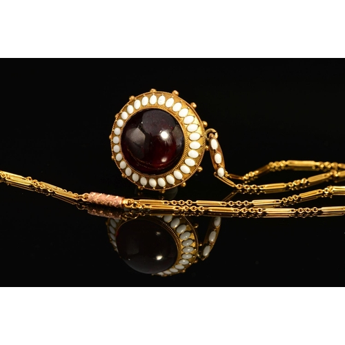 37 - A MID VICTORIAN GOLD GARNET AND WHITE ENAMEL PENDANT, centring on a large cabochon circular garnet m... 