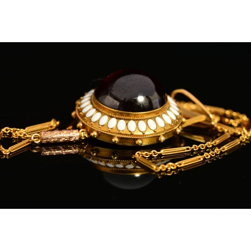 37 - A MID VICTORIAN GOLD GARNET AND WHITE ENAMEL PENDANT, centring on a large cabochon circular garnet m... 