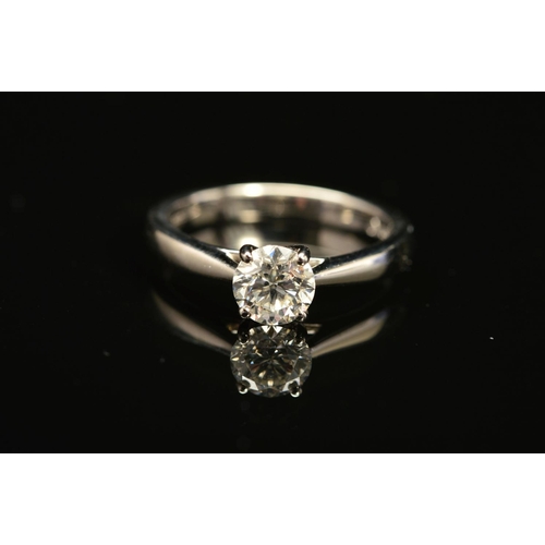 39 - A MODERN PLATINUM DIAMOND SINGLE STONE RING, a modern round brilliant cut diamond, together with a d... 