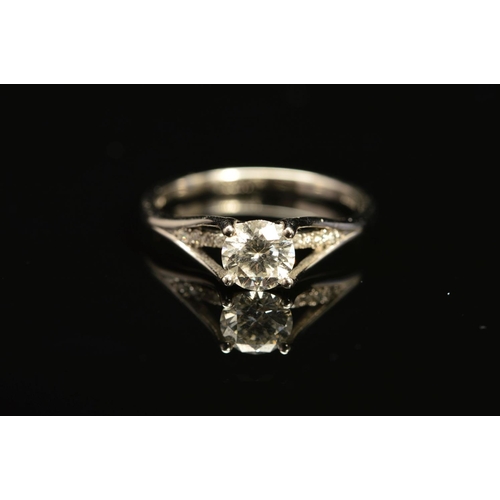 41 - A MODERN PLATINUM DIAMOND SINGLE STONE RING, with a diamond set under band, principle diamond accomp... 