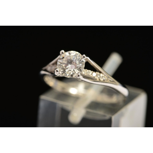 41 - A MODERN PLATINUM DIAMOND SINGLE STONE RING, with a diamond set under band, principle diamond accomp... 