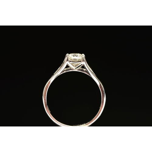 41 - A MODERN PLATINUM DIAMOND SINGLE STONE RING, with a diamond set under band, principle diamond accomp... 