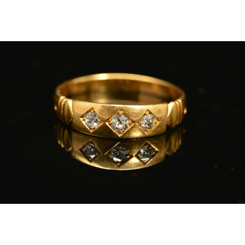 43 - A LATE VICTORIAN 18CT GOLD THREE STONE DIAMOND RING, designed as three old cut diamonds claw set wit... 