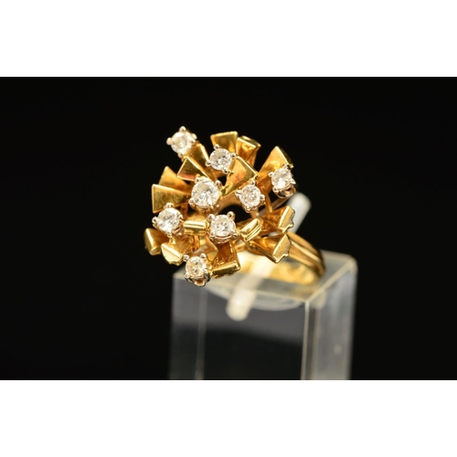 45 - A 1970'S 18CT GOLD ABSTRACT DIAMOND SET RING, designed as spokes claw set with brilliant cut diamond... 