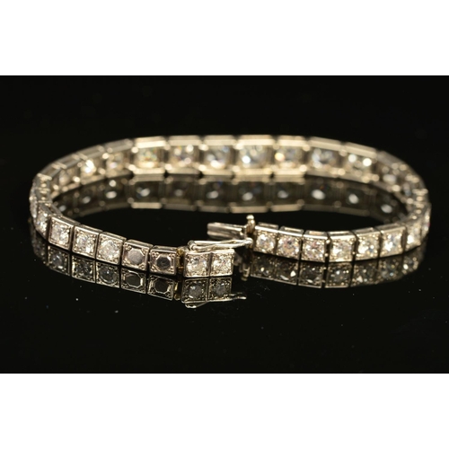 49 - AN ART DECO GRADUATED DIAMOND LINE BRACELET, brilliant cut diamonds, each set to a box setting gradu... 