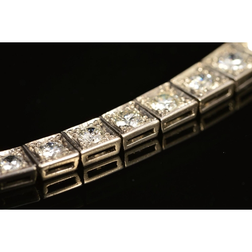 49 - AN ART DECO GRADUATED DIAMOND LINE BRACELET, brilliant cut diamonds, each set to a box setting gradu... 