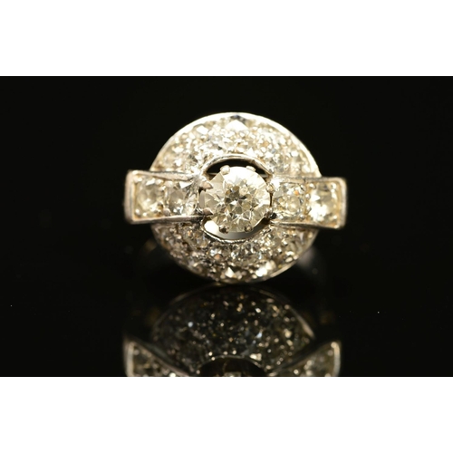 5 - AN EARLY TO MID 20TH CENTURY DOMED CLUSTER RING, centring on an old European diamond, measuring appr... 