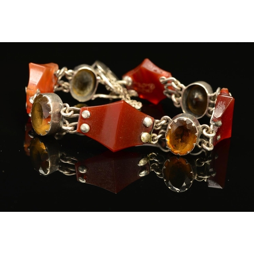 52 - A SCOTTISH BRACELET, designed as four shaped agate pieces, each interspaced by an oval citrine to th... 