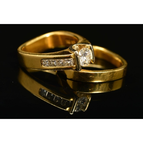 56 - TWO RINGS, the first an abstract design diamond ring, centring on a principle modern round brilliant... 