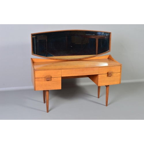 589 - IB KOFOD LARSEN, FOR GPLAN DANISH RANGE, a teak 1960s dressing table, with a shaped mirror above on... 