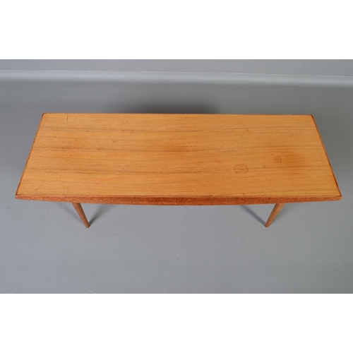 593 - GORDON RUSSELL, BROADWAY WORKS, a teak coffee table, with shaped sides on four square tapering legs,... 