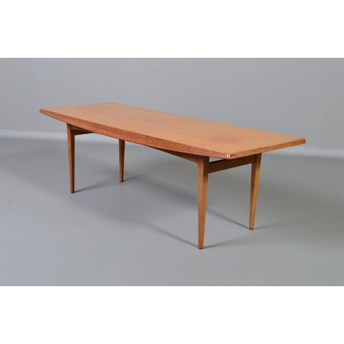 593 - GORDON RUSSELL, BROADWAY WORKS, a teak coffee table, with shaped sides on four square tapering legs,... 