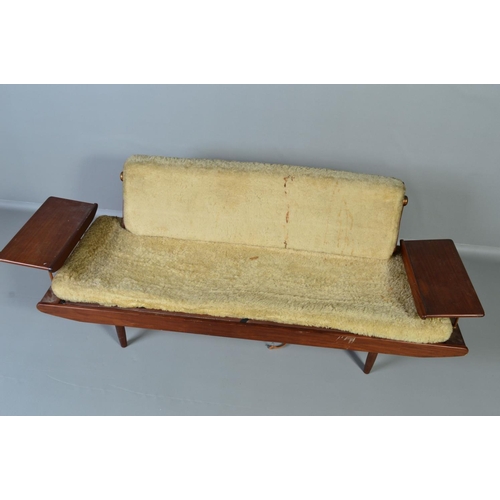 595 - A TOOTHILL 1950'S/60'S DANISH STYLE AFROMOSIA TEAK DAY BED/SOFA, with a flip over back and flanked b... 