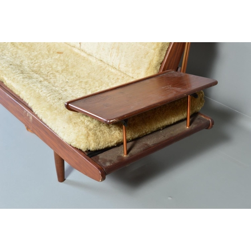 595 - A TOOTHILL 1950'S/60'S DANISH STYLE AFROMOSIA TEAK DAY BED/SOFA, with a flip over back and flanked b... 