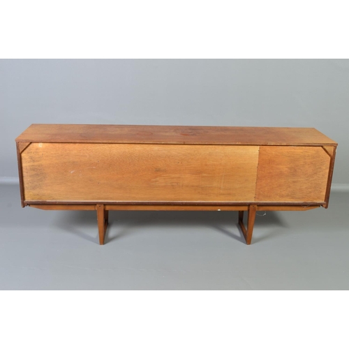 598 - A STONEHILL TEAK SIDEBOARD, the door fronts with a geometric pattern and central shaped handle, flan... 