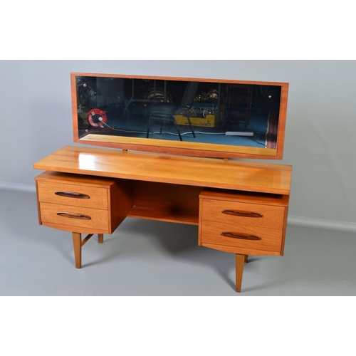 599 - A GPLAN STYLE DRESSING TABLE, with a rectangular mirror, above flanked by two drawers to each side o... 