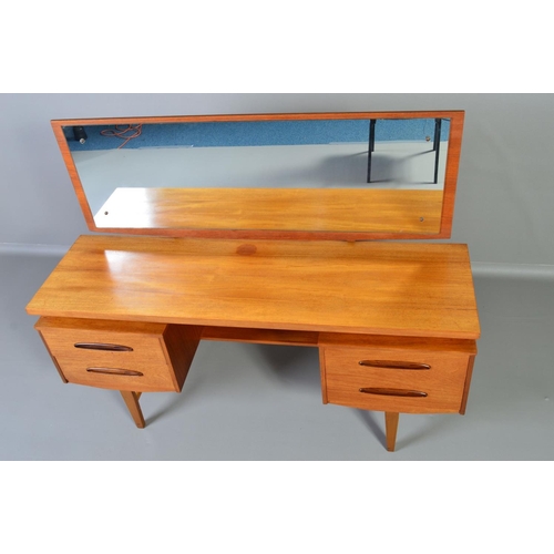 599 - A GPLAN STYLE DRESSING TABLE, with a rectangular mirror, above flanked by two drawers to each side o... 