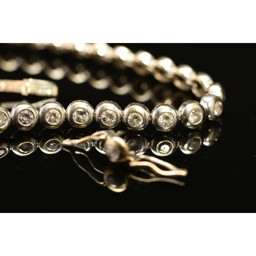 6 - A LATE 20TH CENTURY 18CT WHITE GOLD DIAMOND LINE BRACELET, estimated total diamond weight 2.28ct, co... 