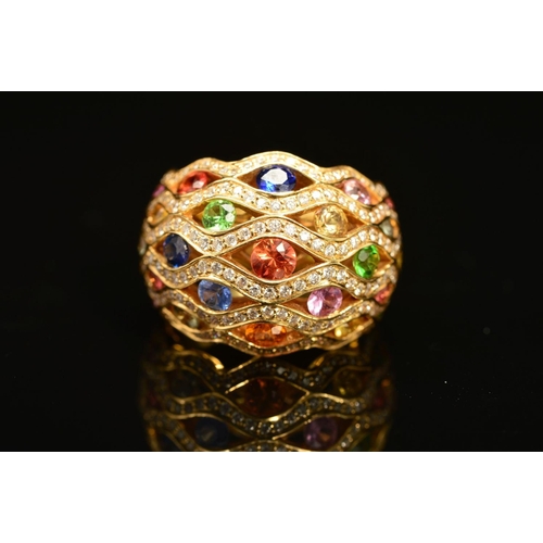 62 - A MODERN 18CT GOLD MULTI GEM AND DIAMOND FANCY BOMBE STYLE DRESS RING, lattice design incorporating ... 