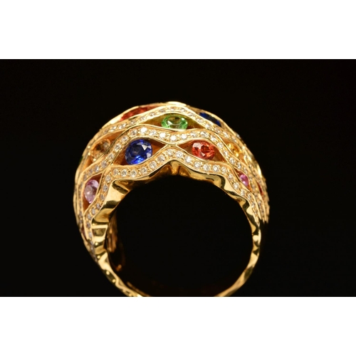 62 - A MODERN 18CT GOLD MULTI GEM AND DIAMOND FANCY BOMBE STYLE DRESS RING, lattice design incorporating ... 