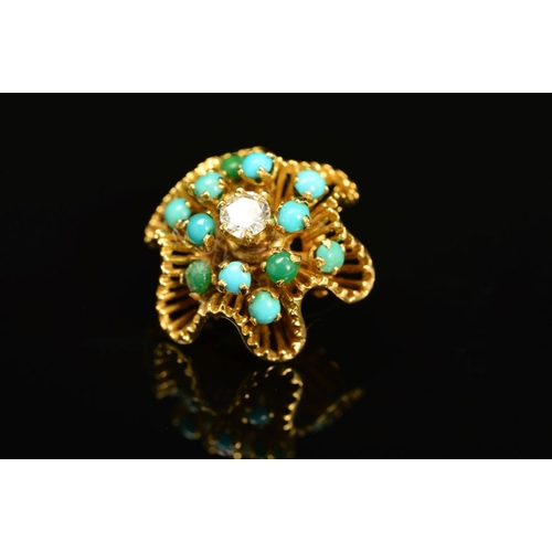 65 - A TURQUOISE AND DIAMOND PENDANT, the floral like undulating outline with tiered spokes claw set with... 