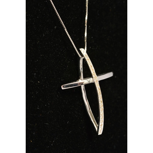 71 - AN 18CT GOLD DIAMOND CROSS PENDANT AND CHAIN, the cross designed as two interlocking navette shapes,... 