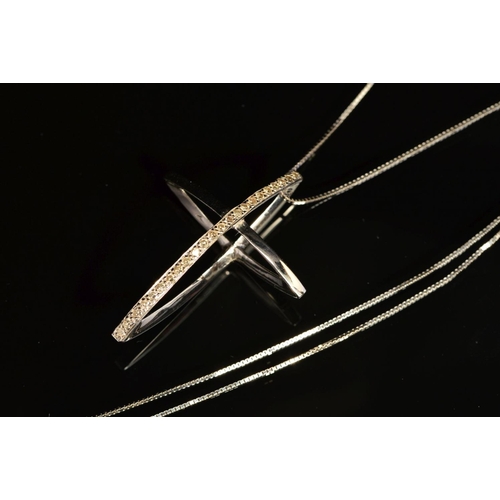 71 - AN 18CT GOLD DIAMOND CROSS PENDANT AND CHAIN, the cross designed as two interlocking navette shapes,... 