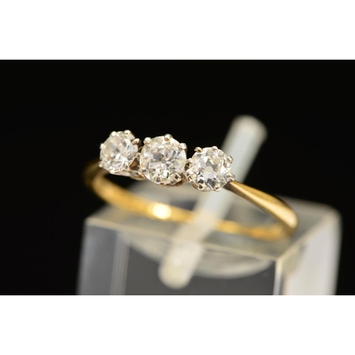 72 - A THREE STONE DIAMOND RING, designed as three graduated diamonds, two old cut and one brilliant cut,... 