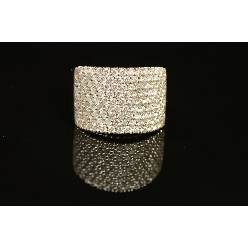 74 - A MODERN 18CT WHITE GOLD WIDE PAVE DIAMOND SET BAND, measuring approximately 14.3mm in diameter, est... 