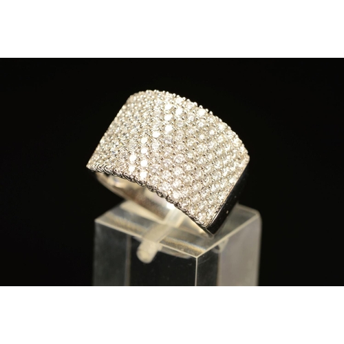 74 - A MODERN 18CT WHITE GOLD WIDE PAVE DIAMOND SET BAND, measuring approximately 14.3mm in diameter, est... 