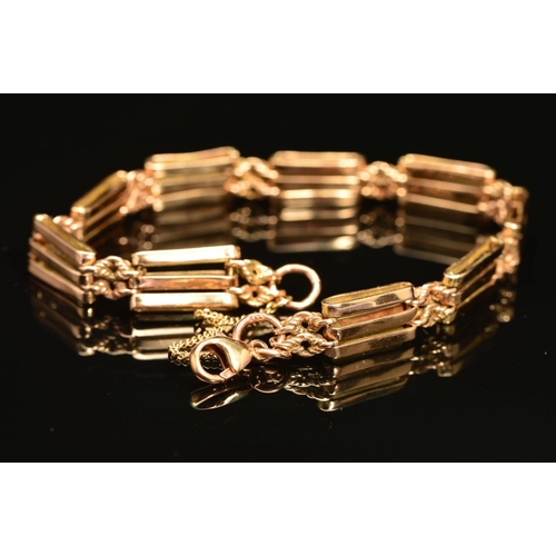 76 - AN EARLY 20TH CENTURY ROSE GOLD THREE STRAIGHT BAR AND KNOT GATE BRACELET, fitted to a later added s... 