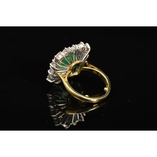 82 - AN IMPRESSIVE 18CT GOLD EMERALD AND DIAMOND CLUSTER RING, centring on an emerald cut emerald measuri... 