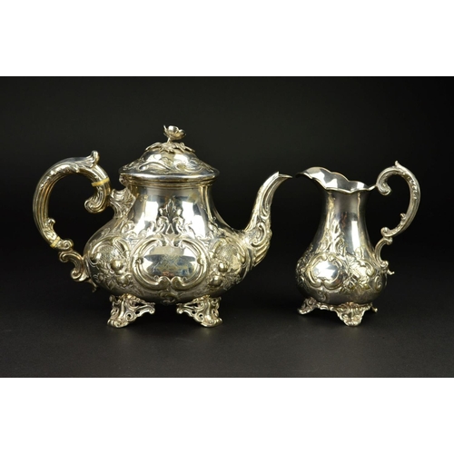 86 - A VICTORIAN SILVER THREE PIECE TEASET, of baluster form, the teapot with flower head finial, ivory i... 