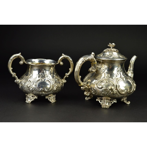 86 - A VICTORIAN SILVER THREE PIECE TEASET, of baluster form, the teapot with flower head finial, ivory i... 