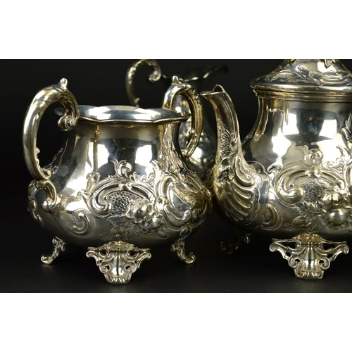 86 - A VICTORIAN SILVER THREE PIECE TEASET, of baluster form, the teapot with flower head finial, ivory i... 