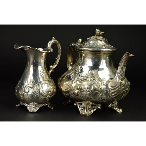 86 - A VICTORIAN SILVER THREE PIECE TEASET, of baluster form, the teapot with flower head finial, ivory i... 