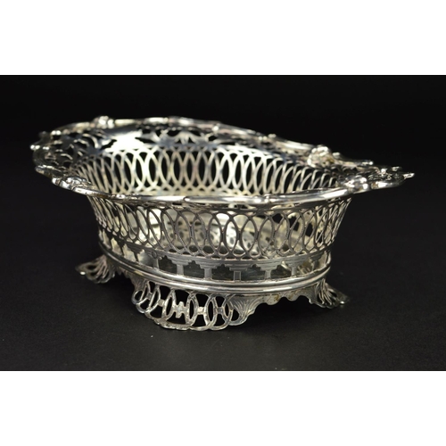 94 - AN EARLY 20TH CENTURY  DUTCH SILVER OVAL DISH, the wavy rim with masks, foliate and geometric pierce... 