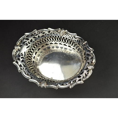 94 - AN EARLY 20TH CENTURY  DUTCH SILVER OVAL DISH, the wavy rim with masks, foliate and geometric pierce... 