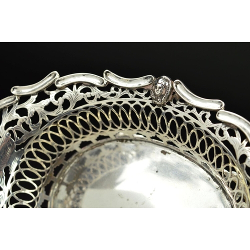 94 - AN EARLY 20TH CENTURY  DUTCH SILVER OVAL DISH, the wavy rim with masks, foliate and geometric pierce... 