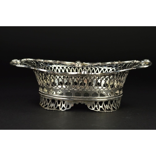 94 - AN EARLY 20TH CENTURY  DUTCH SILVER OVAL DISH, the wavy rim with masks, foliate and geometric pierce... 