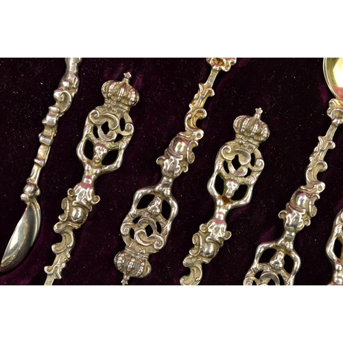 95 - A CASED SET OF TWELVE VICTORIAN SILVER TEASPOONS AND MATCHING SUGAR TONGS, cast with crown finials h... 